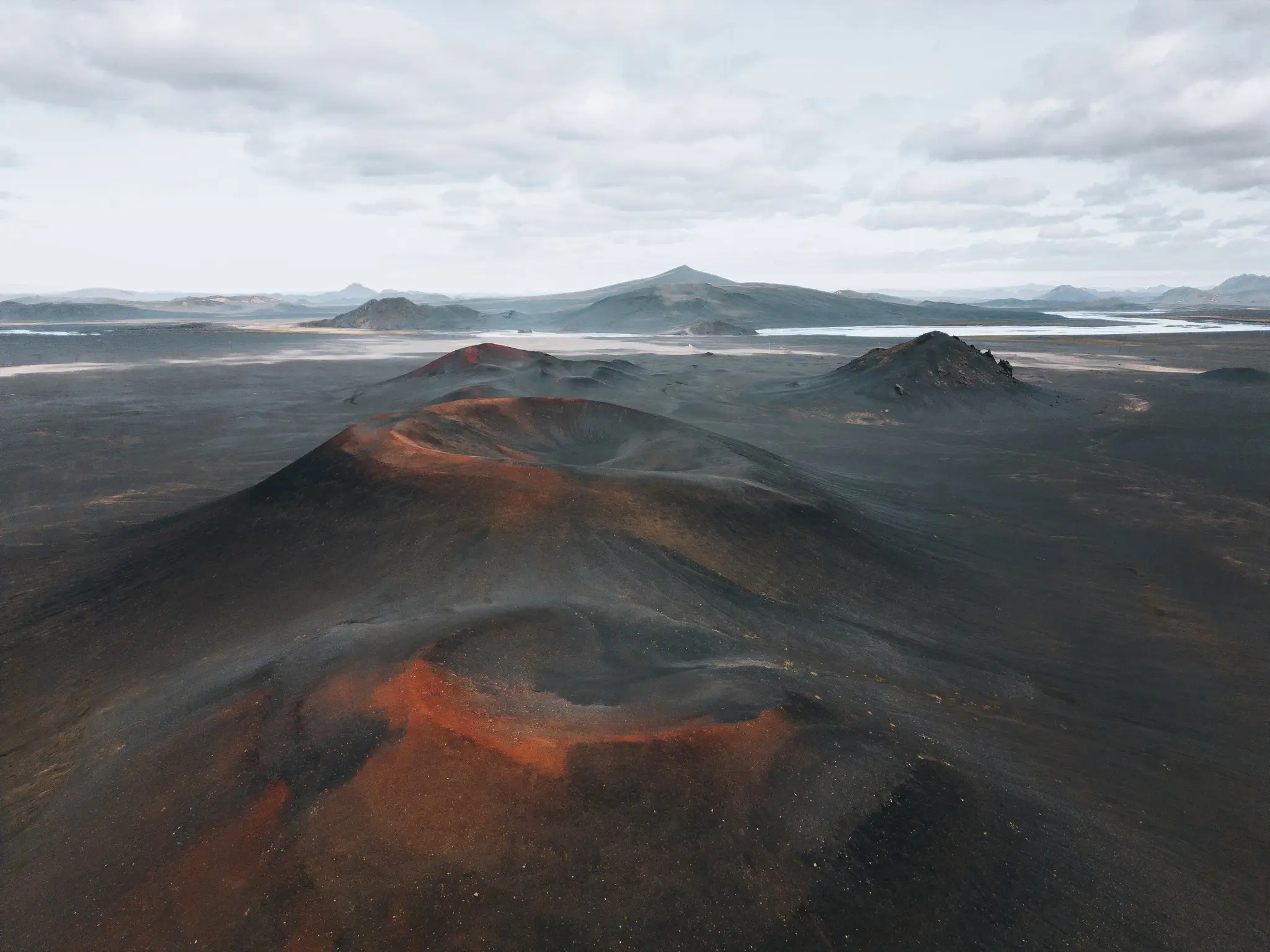 aerial view of volcanic landscape with red craters in Iceland