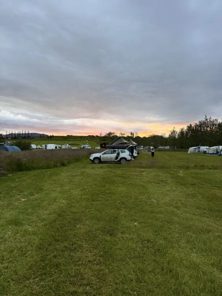 campsite at sunset with car and tents in Iceland