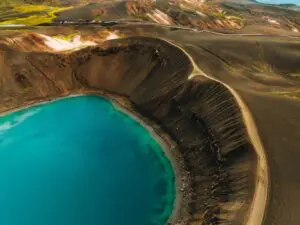 aerial view of turquoise crater lake and volcanic landscape in Iceland